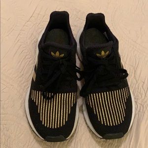 Black and gold Adidas